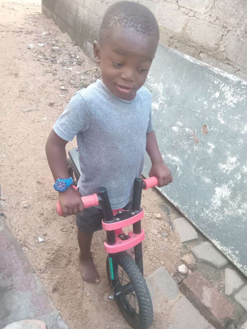 Young child with a balance bike — early childhood development