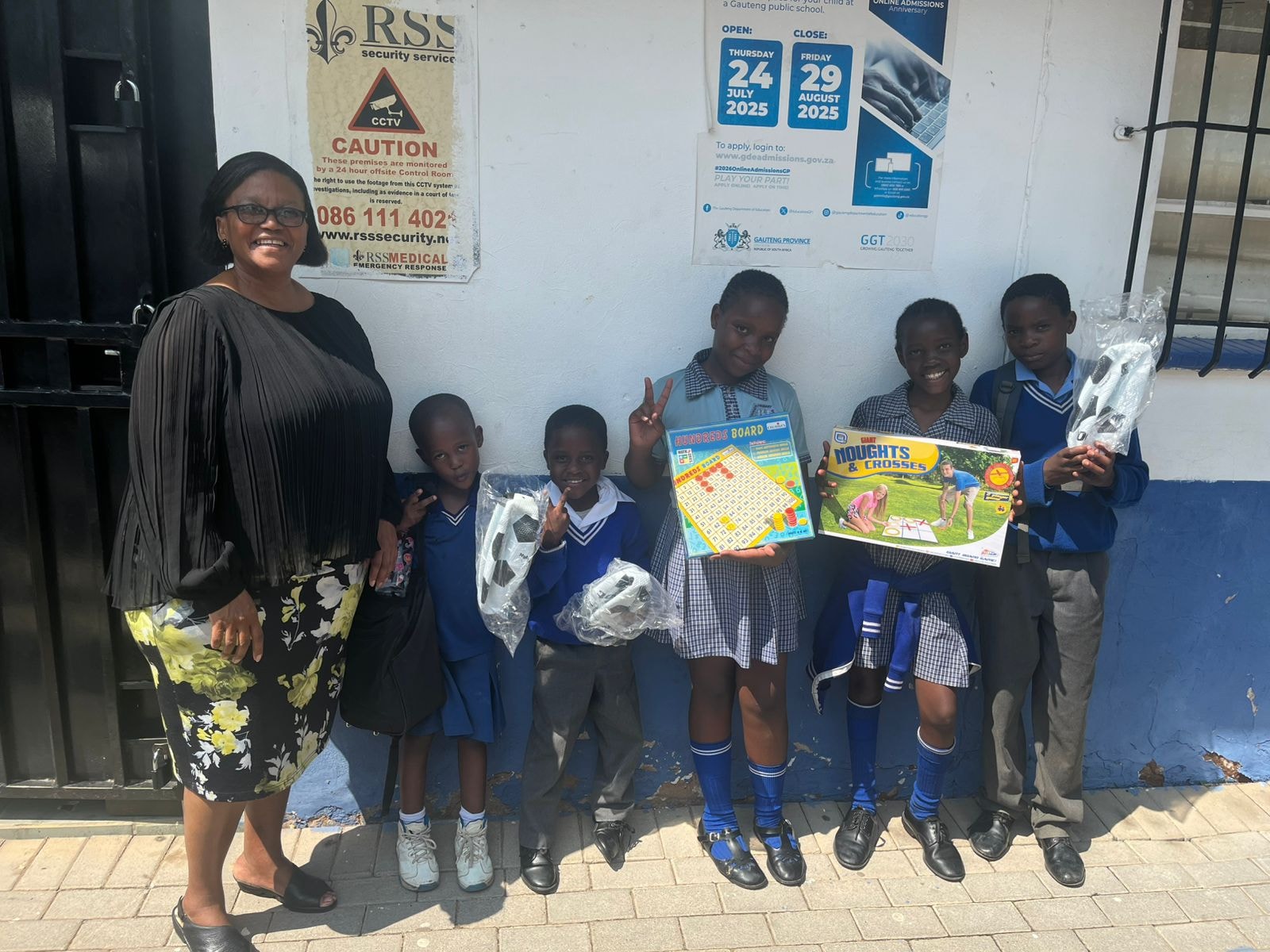 Educator with students receiving educational games at school